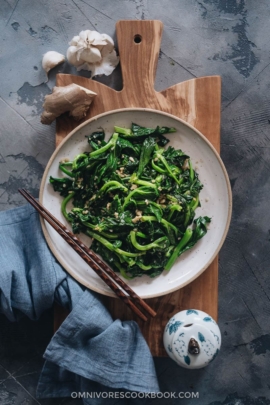 Homemade stir-fried pea shoots with garlic