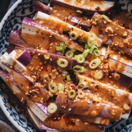 Steamed eggplant in nutty sauce closeup