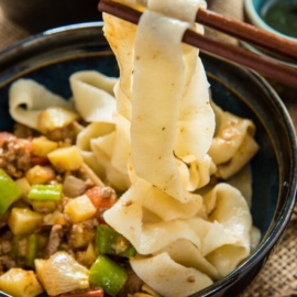 The tender ground lamb meat is cooked with potato, tomato, onion, and pepper to create a simple, colorful, and delectable noodle sauce - Uyghur-Style Noodles with Lamb Sauce (Laghman, 新疆拌面) | omnivorescookbook.com