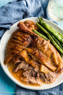 The Best Slow Roast Duck (A recipe from a chef) - The duck is stuffed with citrus, then slow cooked until the meat is falling off the bones and the skin perfectly crisped. | omnivorescookbook.com