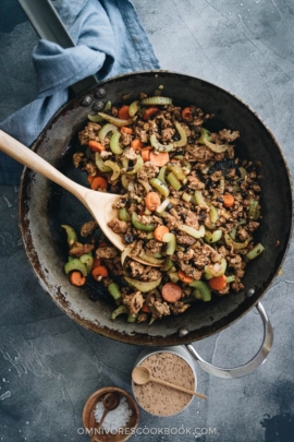 Ground beef stir fry with celery in a frying pan