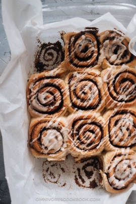 Cinnamon rolls in a pan with glaze