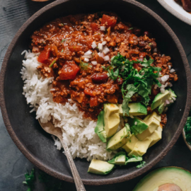 Chinese served over steamed rice with avocado and cilantro