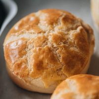 Learn how to make Asian bakery style pineapple buns in your own kitchen. These buns are light, soft, and airy, with an extra crispy, buttery, and sugary crust that cracks perfectly into a pineapple pattern. Detailed step-by-step pictures and video are included to walk you through each detail.