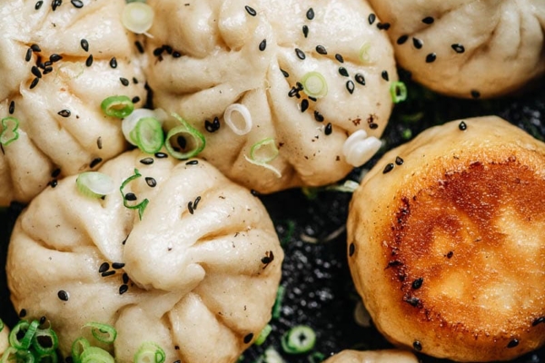 Sheng Jian Bao garnished with sesames and green onion