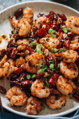 Stir fried shrimp accented with bright pop of Sichuan flavor: chile pepper, tingly peppercorn, and a dose of umami will just dazzle your taste buds.