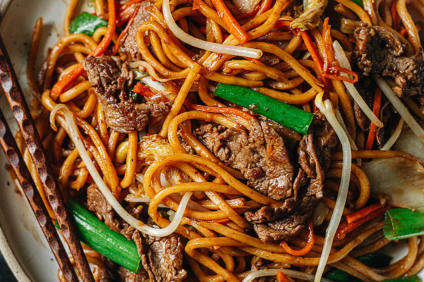 Authentic takeout-style beef lo mein with green onion