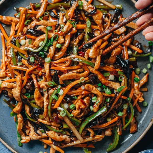 Shredded pork with garlic sauce on a plate close up