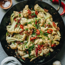 Chinese dry pot cauliflower features crispy cauliflower bites stir fried with bacon and chili peppers in an aromatic savory sauce. It is super easy and fast to put together, and it’s addictively tasty! {Gluten-Free Adaptable}