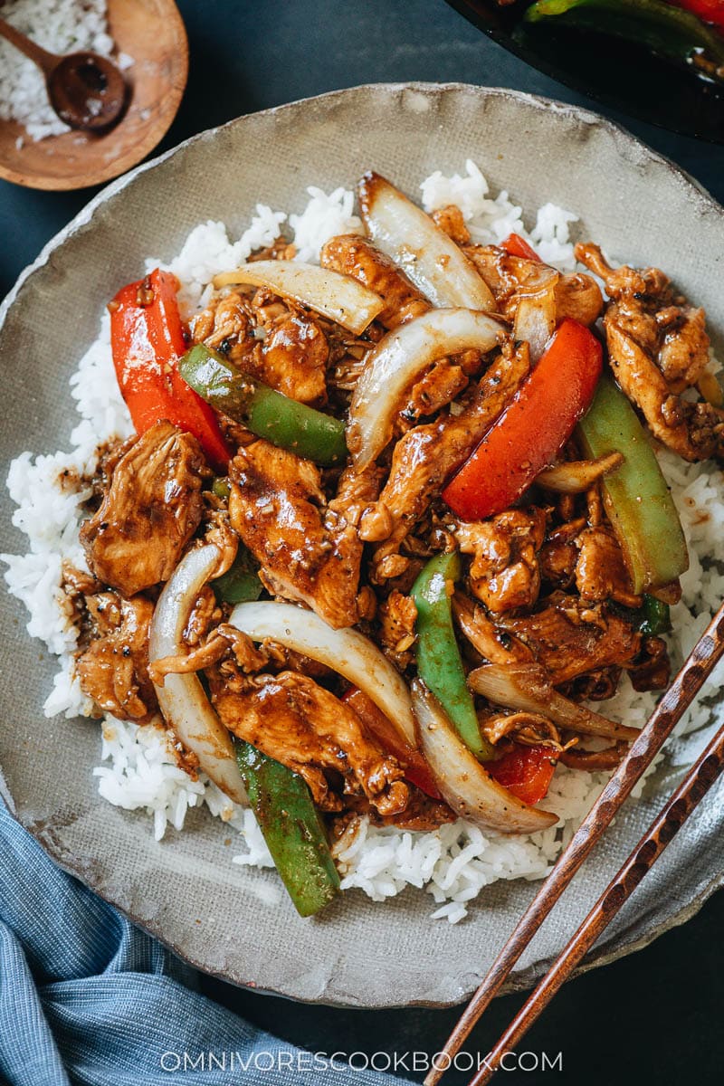 Chinese restaurant style black pepper chicken served on a plate close up