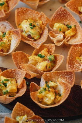 Egg salad served in crispy wonton cups close up