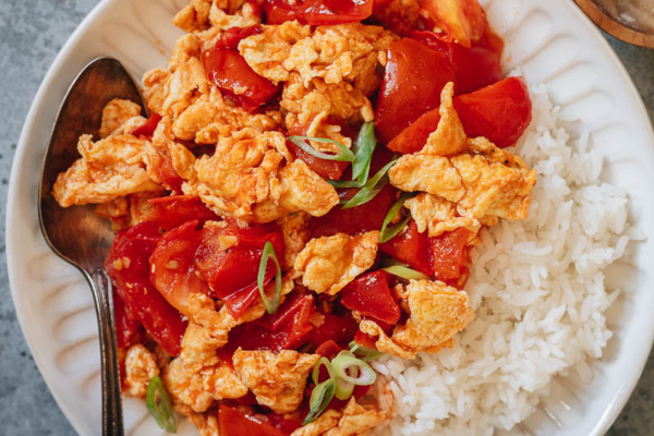 Tomato and egg stir fry served with steamed rice