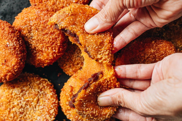 Breaking apart a Chinese pumpkin cake