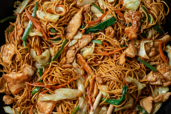 Chicken chow mein in a pan close up