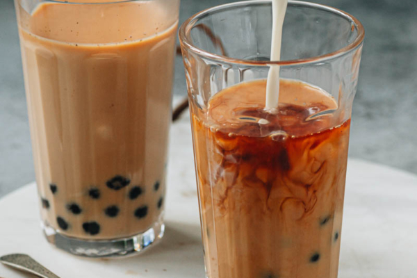 Pouring milk into bubble tea