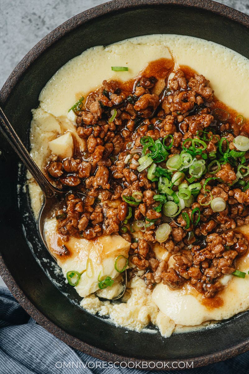 Eating steamed eggs topped with pork gravy