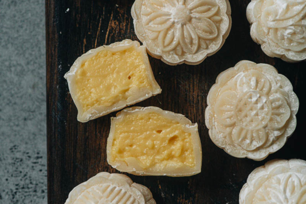 Snow skin mooncake with custard sliced open close up