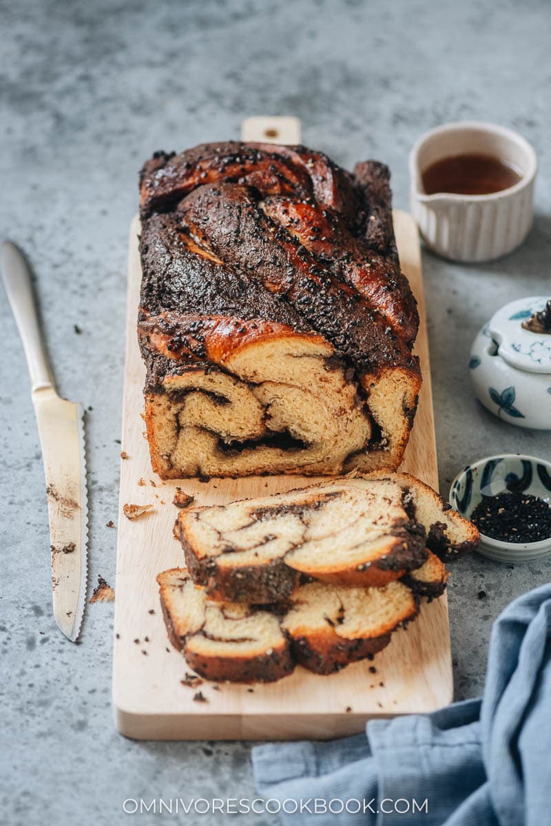 A loaf of half cut black sesame babka